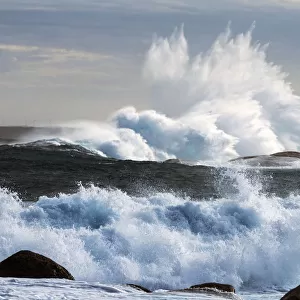 Extreme weather with waves crashing on coast