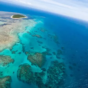 Flying over green island