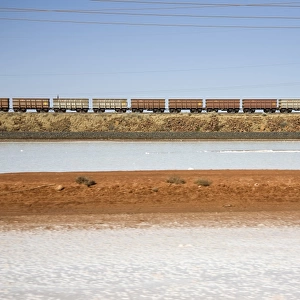 Freight train moving through a barren landscape, Port Hedland, Western Australia, Australia