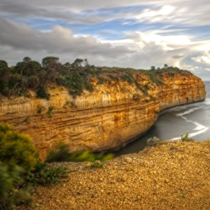 Great Ocean Road limestone cliffs and bay sunset