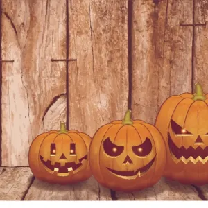 Halloween background [Pumpkin on the wooden board]
