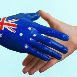 Hand painted flag of Australia doing a handshake Hand painted flag of Australia doing a handshake