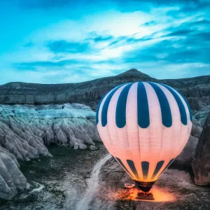 A hot air balloon is preparing to fly