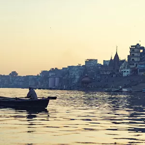 indian people rowing boat in Ganga river varanasi india