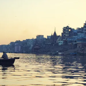 indian people rowing boat in Ganga river varanasi india