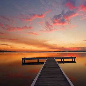jetty with sunset at lake