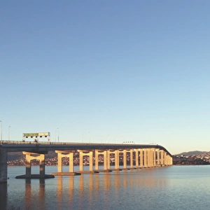 Large concrete bridge crossing river