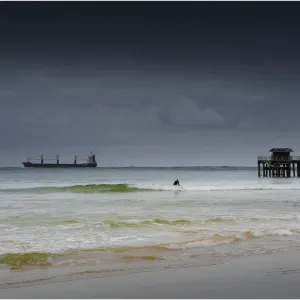 Large container ship entering Port Phillip bay on a cold bleak winter morning, Victoria