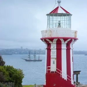 Lighthouse in the harbour with the three-master Bounty, Sydney