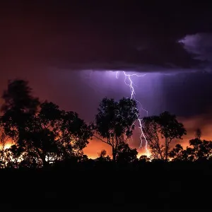 Lightning fork striking a bushfire photographed at night, The Kimberley, Western Australia, Australia
