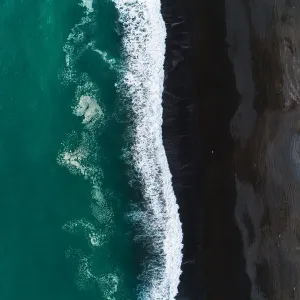 Looking down at black sand beach
