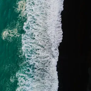 Looking down at black sand beach