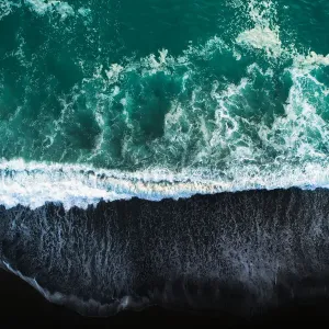 Looking down at black sand beach