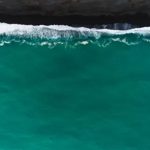 Looking down at black sand beach