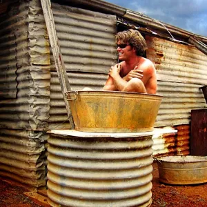 Man Sitting in a Bath Tub Man Sitting in a Bath Tub