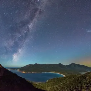 Milky Way and Aurora over a moonlit Wineglass Bay