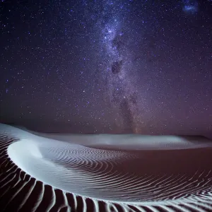 Milky Way and stars over a sand dune. Australia