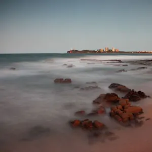 Mooloolaba Beach in the early evening at dusk with the lights of the buildings lit up