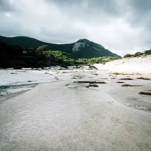 Mount Bishop viewed from Squeaky Beach leading in Wilsons Promontory National Park, Australia Mount Bishop viewed from Squeaky Beach leading in Wilsons Promontory National Park, Australia
