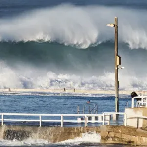 Newcastle Ocean Baths Print - Large Swell Breaking Over the Water Newcastle Ocean Baths Print - Large Swell Breaking Over the Water