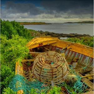 Old derelict boat and Lobster pot at the Currie foreshore, King Island, Bass Strait, Tasmania, Australia