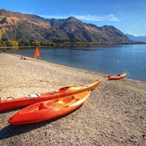 Orange boats on beach at Lake Wanaka