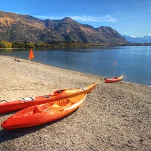 Orange boats on beach at Lake Wanaka Orange boats on beach at Lake Wanaka
