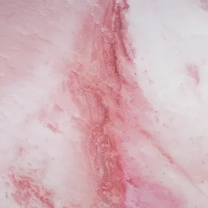 Pattern on the surface of a pink coloured salt lake shot from a birds-eye point of view Pattern on the surface of a pink coloured salt lake shot from a birds-eye point of view