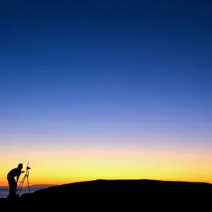 Photographer with camera and tripod Photographer with camera and tripod