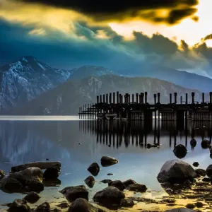 The pier at Lake Chuzenji with snow capped mountains, in a late winter evening