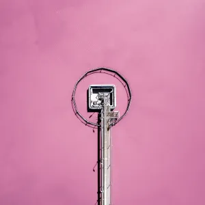 Pier in a pink coloured salt lake shot from a drone point of view Pier in a pink coloured salt lake shot from a drone point of view