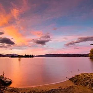 Pink and Orange Clouds on a Blue Sky at Sunset over Lake Jindabyne, Australia