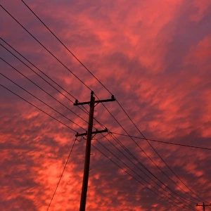 power pole and lines with clouds