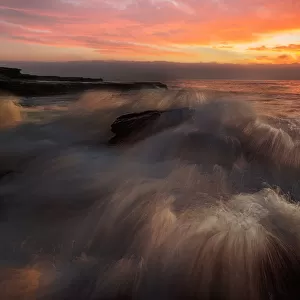 Powerful Waves crushing on a rocky beach
