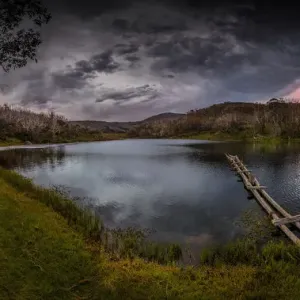 Rainbow lake in the summer with a passing storm, Snowy mountains Rainbow lake in the summer with a passing storm, Snowy mountains