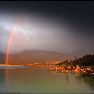 A rainbow after a storm at Fotheringate beach, Flinders Island, Bass Strait, Tasmania, Australia