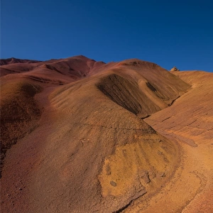 The red ochre colours of the eroded landscape on Phillip Island