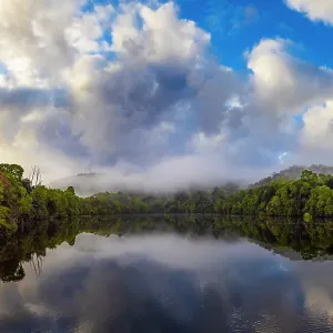 Reflected light over the Pieman river in the Tarkine wilderness area on the west coast of Tasmania Reflected light over the Pieman river in the Tarkine wilderness area on the west coast of Tasmania