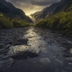 River in Franz Josef Glacier Valley, New Zealand River in Franz Josef Glacier Valley, New Zealand