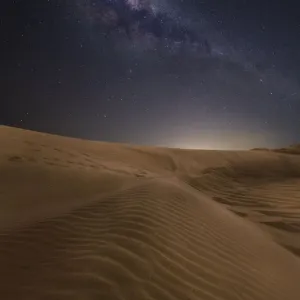 Sand dunes with stars and milkyway above Sand dunes with stars and milkyway above