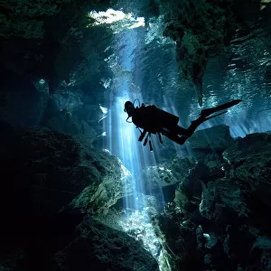 Scuba diver inside cenote in Mexico