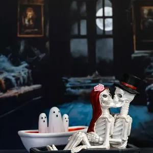 Skeleton couple in haunted room