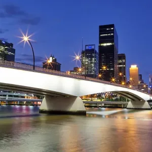 Skyline of Brisbanes Central Business District with Victoria Bridge at night