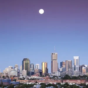 Skyline under full moon at dawn