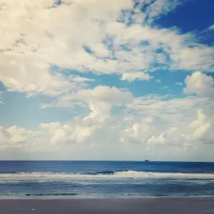 Small island on the horizon of the ocean