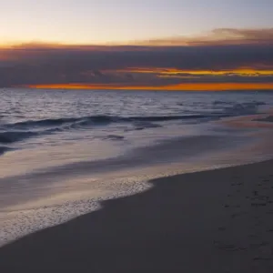 A smokey sunset on the beach after the bushfires creates a glorious red sky A smokey sunset on the beach after the bushfires creates a glorious red sky