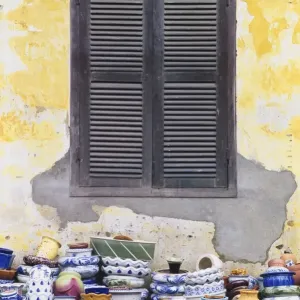 Stacks of Pottery by Window