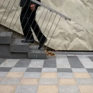 Print of a Man Climbing Stairs