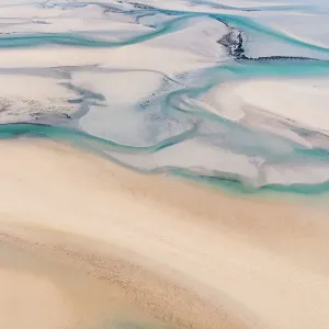 Streams of water flowing in Willie Creek estuary at low tide shot from an aerial perspective, The Kimberley, Western Australia, Australia Streams of water flowing in Willie Creek estuary at low tide shot from an aerial perspective, The Kimberley, Western Australia, Australia