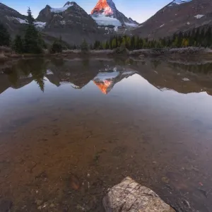 Sunrise at Mount Assiniboine with reflection